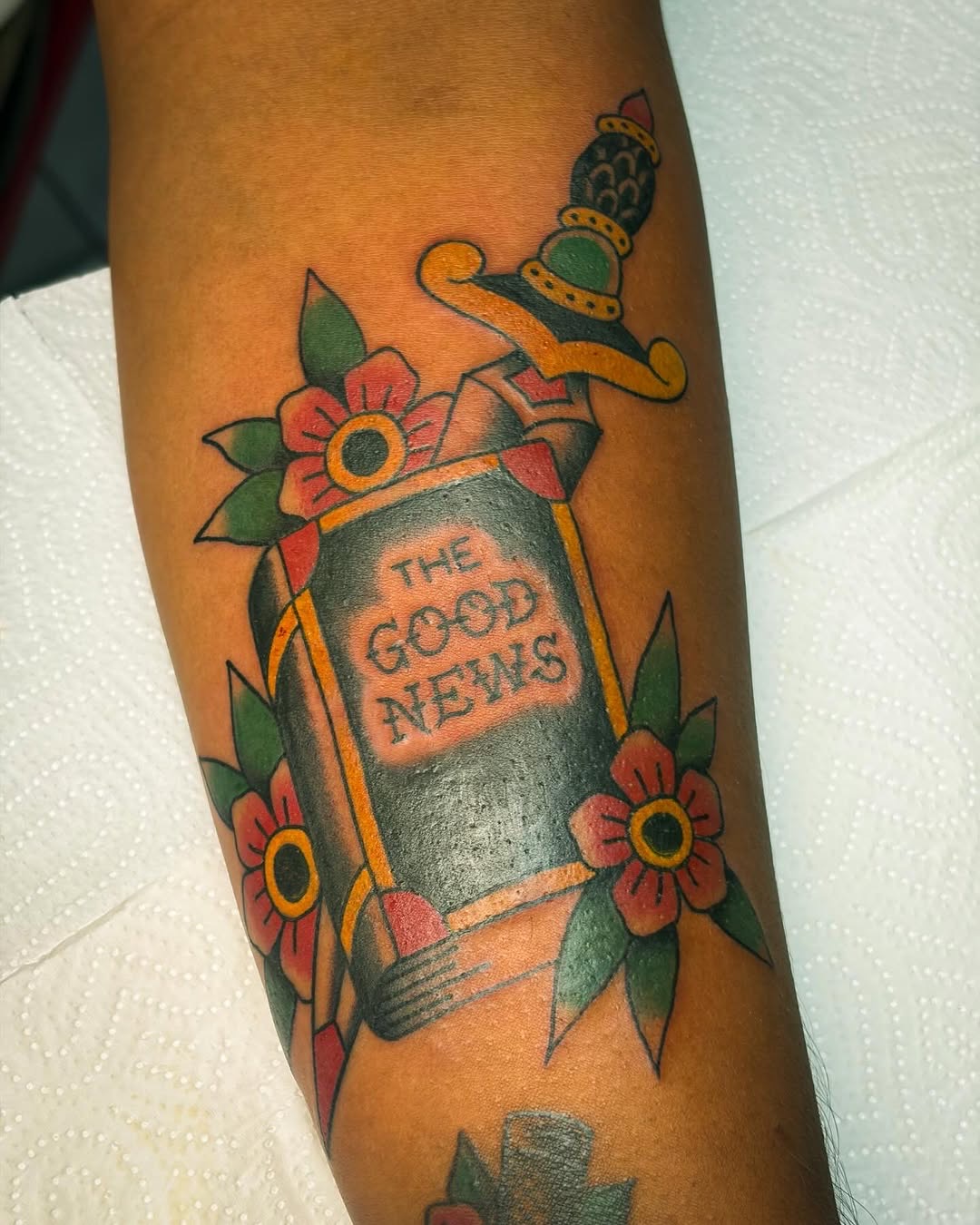 Bible and dagger traditional tattoo